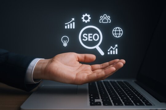 Hand Presenting SEO Optimization Concepts for Business Growth and Online Marketing Success on Laptop - Powered by Adobe