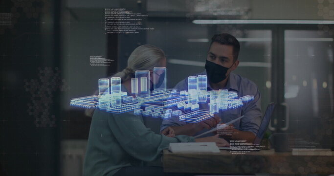 Masked colleagues discussing holographic 3D model in office, with laptop notebooks pen coffee mug