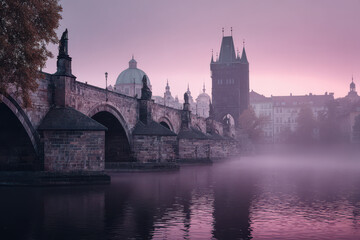 Fototapeta premium mystical morning fog envelops historic charles bridge in prague creating ethereal atmosphere
