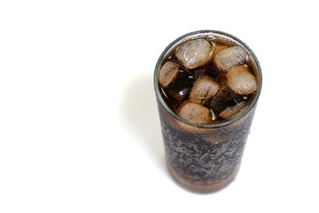 A cold glass of cola with ice in a glass