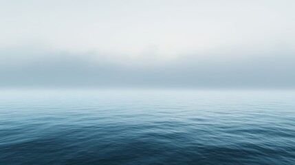 Obraz premium A mysterious ocean scene with rolling fog drifting over the water, on blurred background