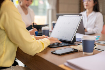 Businesswomen working using digital tablet during office meeting