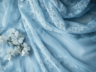 Delicate blue lace fabric with white flowers, elegant texture background