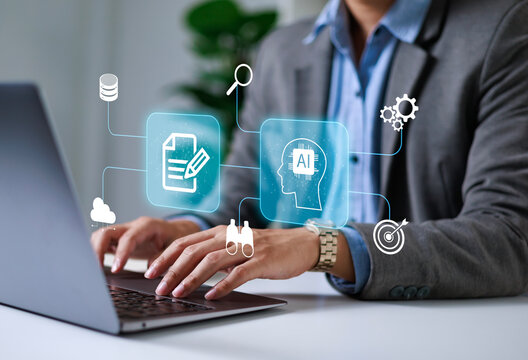Businessman using laptop to control AI at desk in office. Artificial intelligence is analyzing data and generating reports. Artificial intelligence and intelligent automation (IA) technology.