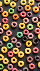 Fototapeta premium Colorful cereal rings on dark background