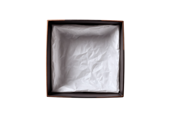 Empty gift box with crumpled white paper interior on a solid black background for versatile packaging inspiration
