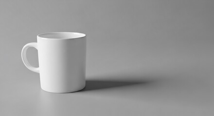 Obraz premium Minimal white ceramic mug on gray background drinkware still life