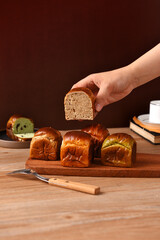 Square-shaped alkaline bread coated with matcha sauce, stacked in multiple pieces