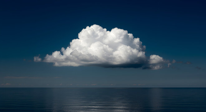 Single Cumulus Cloud Over Calm Ocean - Dramatic Sky and Water