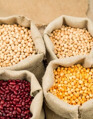 Fototapeta premium Dried legumes in burlap sacks