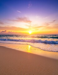 Obraz premium A serene beach scene at sunset, with gentle waves lapping the shore, casting golden reflections on the water as the sun dips below the horizon.