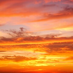 Naklejka premium A sleek airplane soars gracefully through a bright blue sky, surrounded by fluffy white clouds, capturing the essence of travel and adventure.