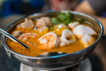 Close up of delicious tom yum. Thai hot spicy soup