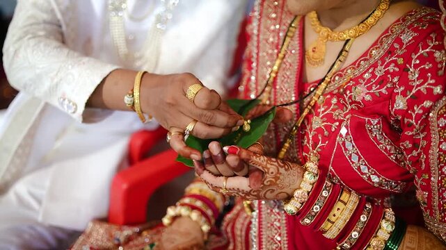 Ceremony of Wearing Turmeric Thread on hand of bride. Marathi Wedding Ceremony. Maharashtra Culture. Hindu wedding rituals and ceremony