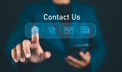 Contact us or Customer support hotline, Businessman touching on virtual screen contact icons (email, address, live chat, telephone). Customer service, helpdesk advice online support people connect.