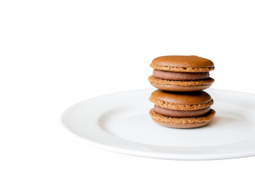 Exquisite Macarons: A close-up of three delectable macarons stacked on a pristine plate, inviting the senses with their vibrant colors and delicate textures. A treat to behold!