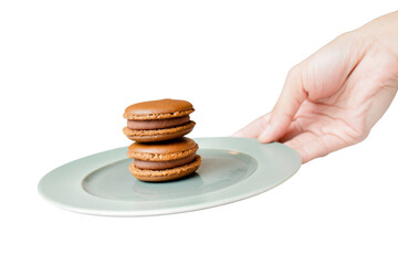 Chocolate Macarons on Plate: A stack of two elegant chocolate macarons sits perfectly poised on a...