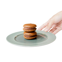 Chocolate Macarons on Plate: A stack of two elegant chocolate macarons sits perfectly poised on a simple pastel plate, creating a delicious contrast of textures and flavors.