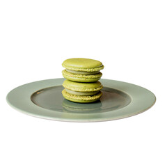 Green Macarons on Plate: A trio of vibrant green macarons, delicately stacked atop a serene, pastel-colored plate, a perfect capture of elegant dessert artistry.