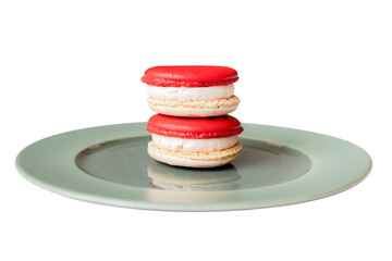 Delicious Macarons Delight: Two vibrantly colored macarons rest artfully on a pristine white plate, a testament to the beauty of culinary artistry.
