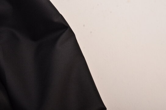 JAKARTA, INDONESIA - JANUARY 6, 2026: A macro shot of black ripstop material used in the manufacturing of heavy-duty tactical equipment.