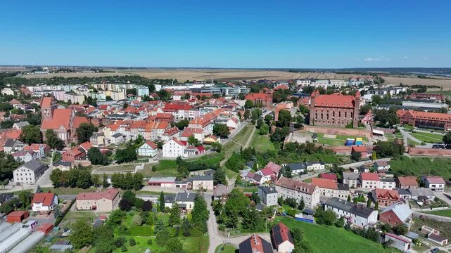 Aerial Gniew Poland historic village and castle circle 2. Northern Poland. Castle construction 13th century by Teutonic Knights. Vistula River. Agriculture land, river, forest and farm rural area.