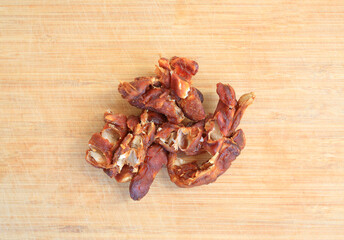 Peeled tamarind on bamboo wooden background, preparation process of tamarind for cooking. Top view.