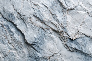 Light gray stone, textured surface with cracks and veins