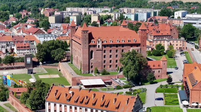 Aerial Gniew Poland historic village and castle pull 1. Northern Poland. Castle construction 13th century by Teutonic Knights. Vistula River. Agriculture land, river, forest and farm rural area.