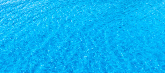 Beach sand background for summer vacation concept. Beach nature and summer seawater with sunlight light sandy beach Sparkling sea water	