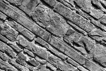 Stone wall background in black and white close up view