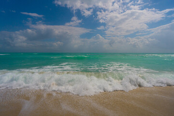 Ocean wave motion on sea shore. Summer sea breeze. Sea nature backdrop. Peaceful ocean. Dreamy ocean horizon. Coastal ocean paradise wallpaper. Seafoam waves. Summer tropical travel.