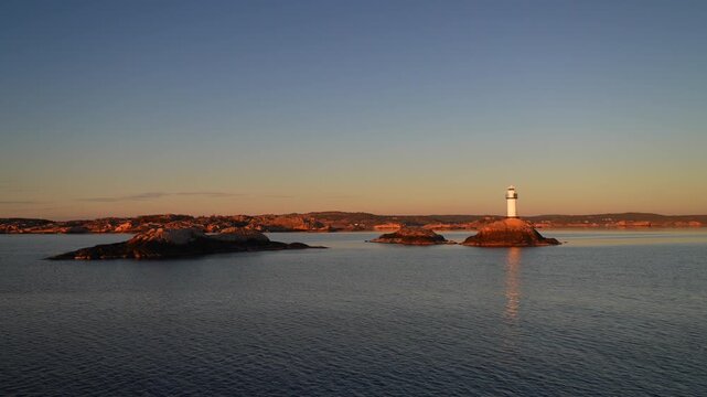 Ursholmen Lighthouse reflection golden hour winter Arctic sunlight sunset ferry boat ride Scandinavia islands Ytre Hvaler National Park Str&ouml;mstad Stromstad Oslo Fjord Sweden Sverige Norway Norge