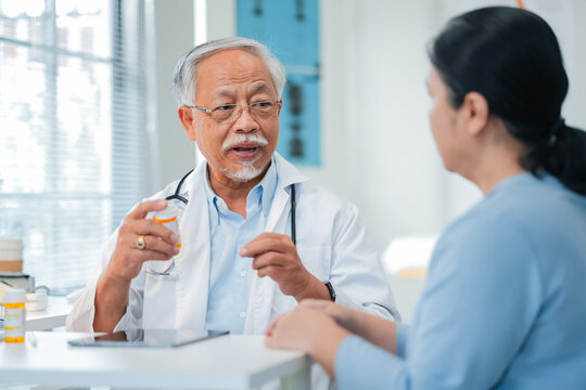 Male senior doctor discusses personalized medicine treatment with female patient hospital. Integrative healthcare approach combines conventional therapy with alternative medicine for holistic patient
