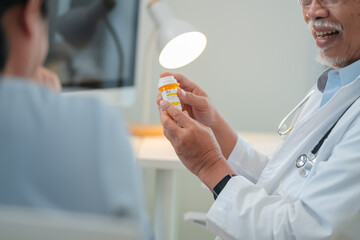Male senior doctor discusses personalized medicine treatment with female patient hospital....