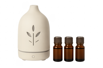 White aroma diffuser with essential oil bottles on transparent background