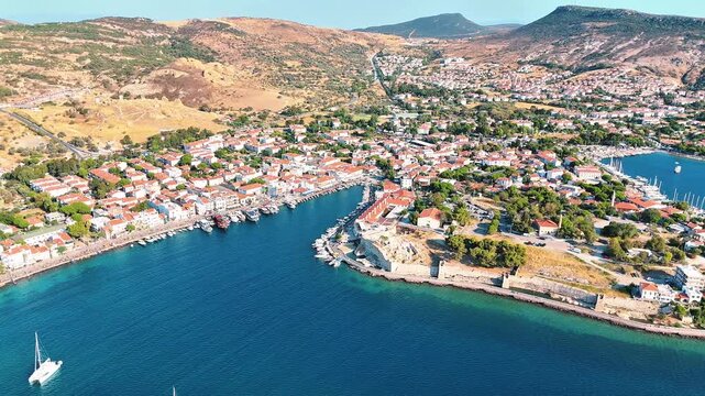 Foca 4k drone video with its windmills, marina and beaches in Izmir, Turkiye.
