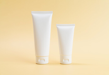 Cosmetic bottles packaging for mockup on a beige background. The concept of natural beauty products.