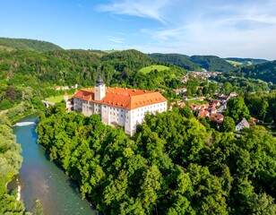 Panoramic view of a castle nestled in a valley