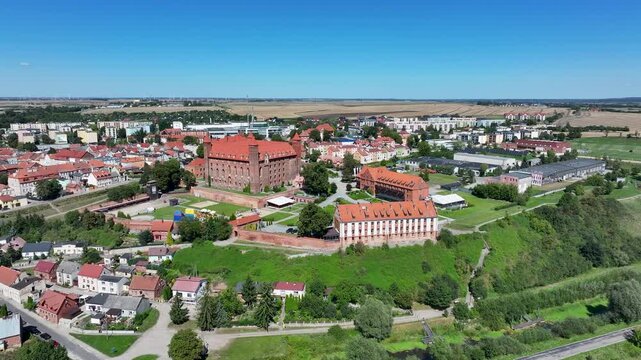Aerial Gniew Poland historic village and castle slide 3. Northern Poland. Castle construction 13th century by Teutonic Knights. Vistula River. Agriculture land, river, forest and farm rural area.