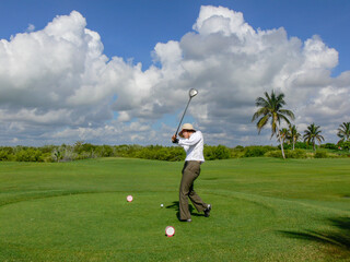 Golfer Swinging at Cancun Resort