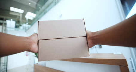 POV, hands and courier with boxes for delivery, shipping and logistics with distribution in office. Package, order and person with ecommerce service for supply chain, parcel and cargo from supplier