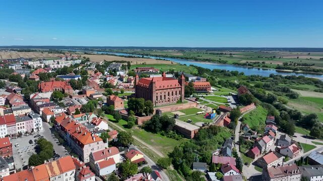 Aerial Gniew Poland Vistula River historic castle circle 1. Northern Poland. Castle construction 13th century by Teutonic Knights. Vistula River. Agriculture land, river, forest and farm rural area.