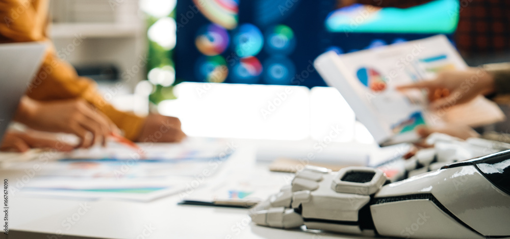 Poster a dynamic business meeting with a diverse team analyzing various data and graphics. advanced technol