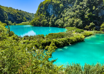 Footpath between lakes in Plitvice Lakes National Park, Croatia. UNESCO World Heritage and tourist attraction. © NG-Spacetime