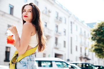 Young beautiful smiling hipster woman in trendy summer clothes. Sexy carefree model posing in the...