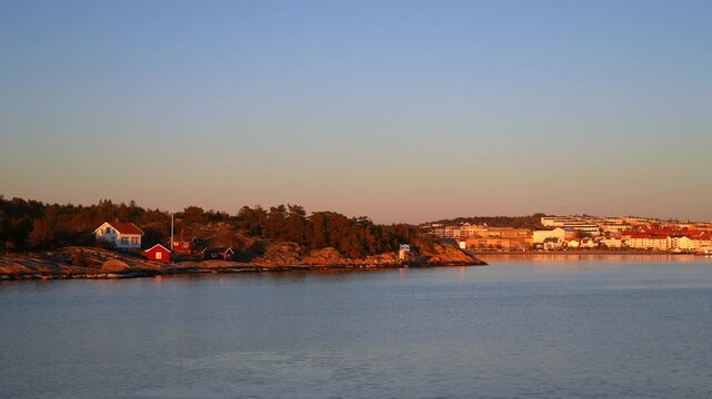 Sandefjord Str&ouml;mstad coastal seaside town tower marina buildings Stromstad Sweden Sverige coastline OsloFjord Nakholmen Island inner Scandaniva sunset golden hour marina yacht sailboat ferry boat ride