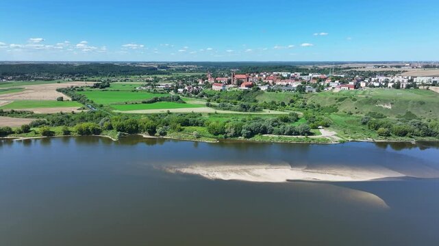 Aerial Gniew Poland Vistula River to castle 1. Northern Poland. Castle construction 13th century by Teutonic Knights. Vistula River. Agriculture land, river, forest and farm rural area.