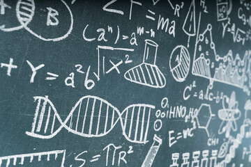 Scientific formulas and DNA structure drawn on chalkboard representing science, chemistry, and...