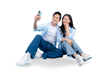 A joyful couple taking selfie with smartphone, with a positive and cheerful look on PNG background